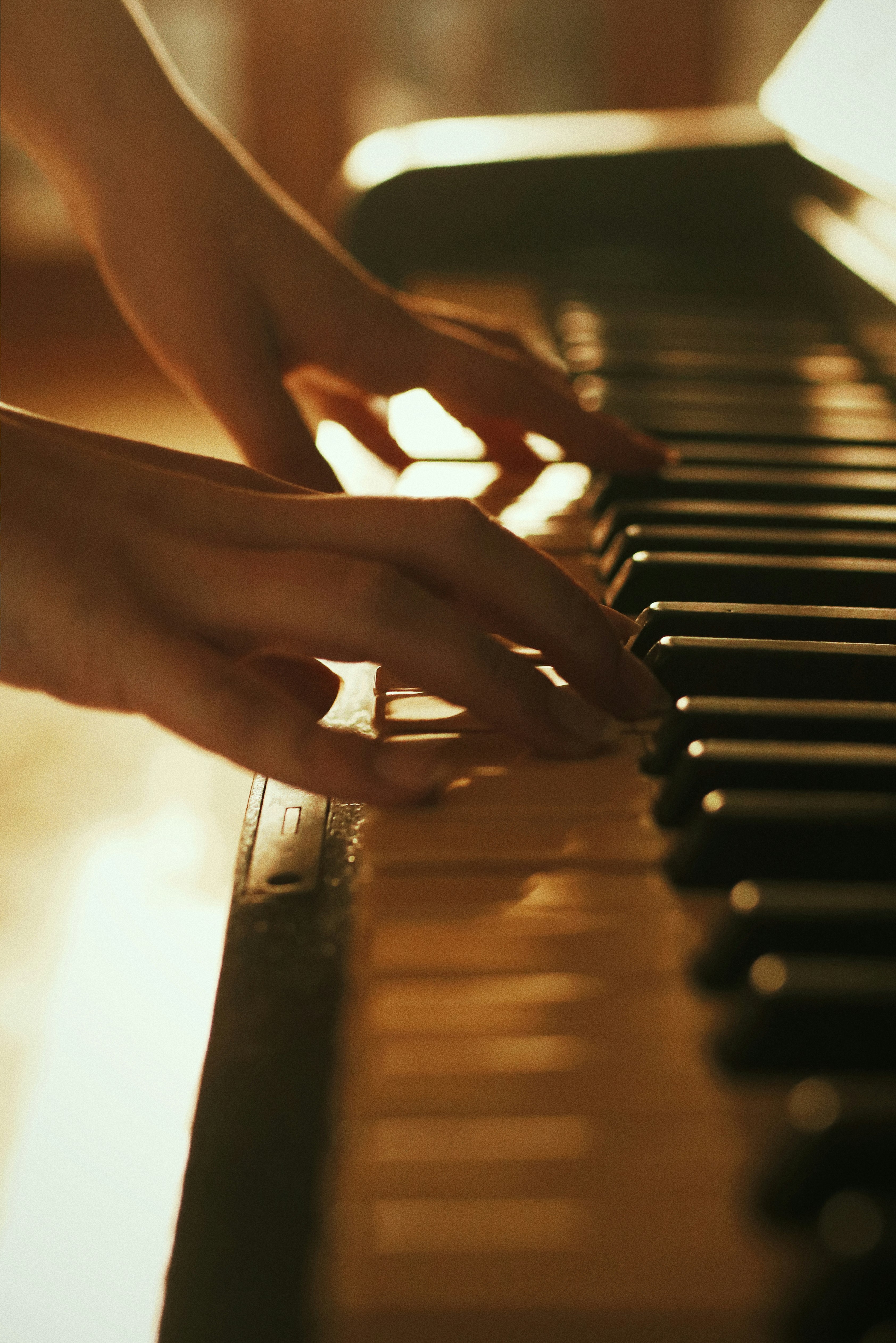 person playing piano during daytime